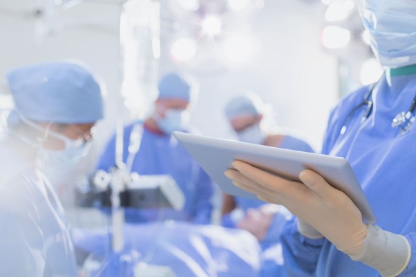 an image of surgeons in a operating theatre