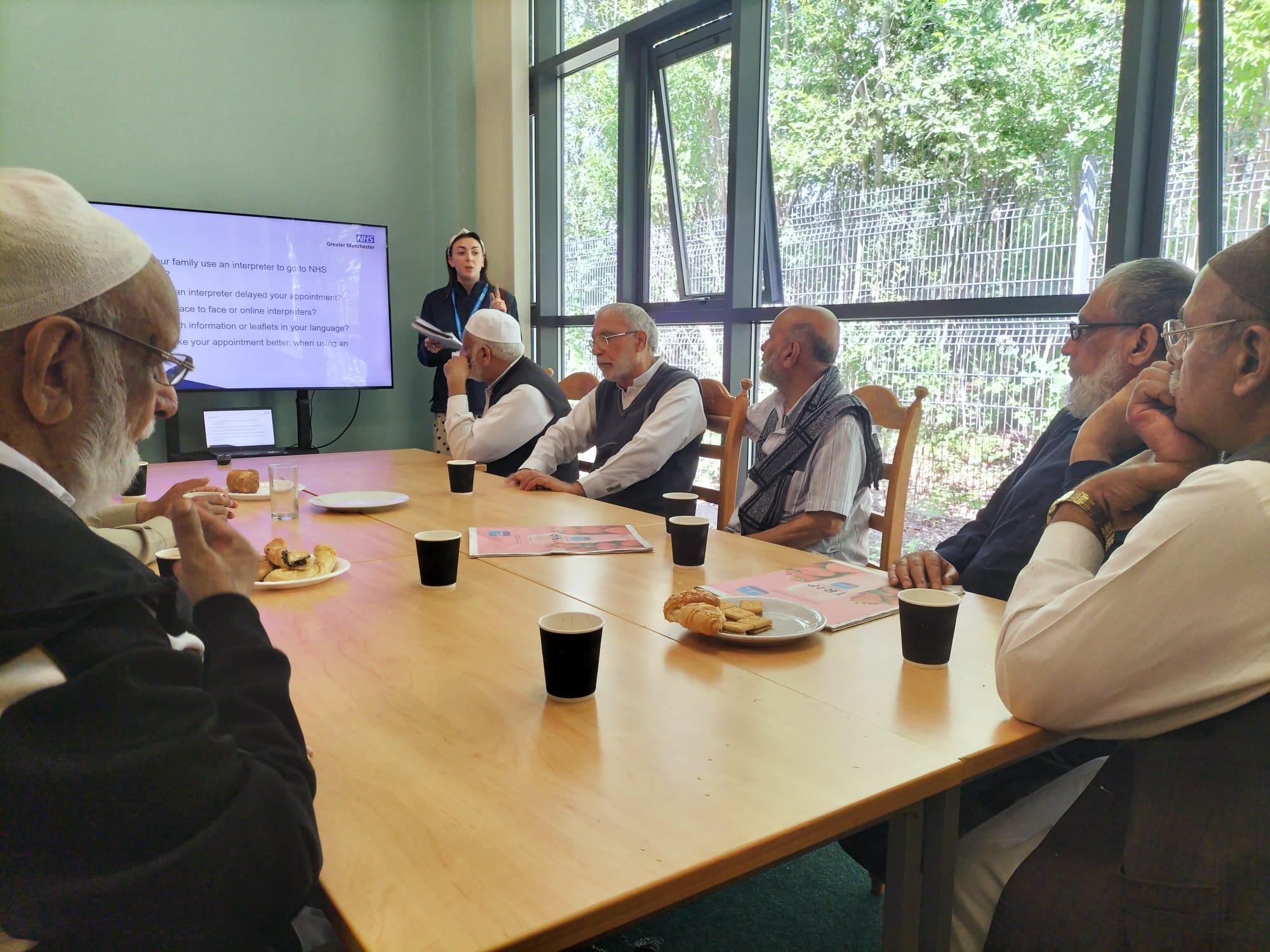 A presentation being delivered to a south Asian men's group