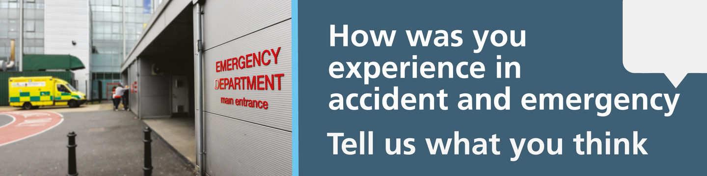 A picture of an emergency department entrance with an ambulance in the background